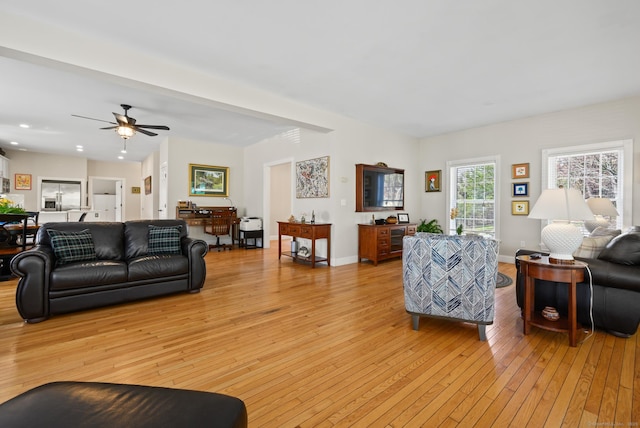 living room with light wood-type flooring, recessed lighting, and ceiling fan