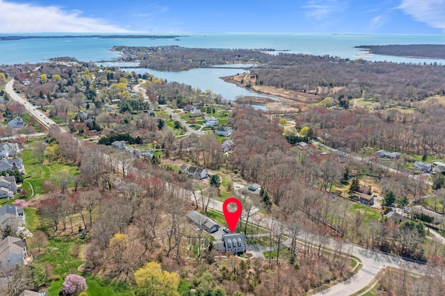 bird's eye view with a water view and a forest view