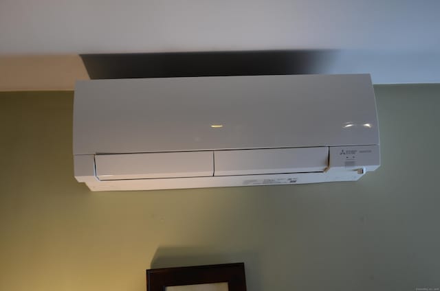 interior details with a wall mounted AC