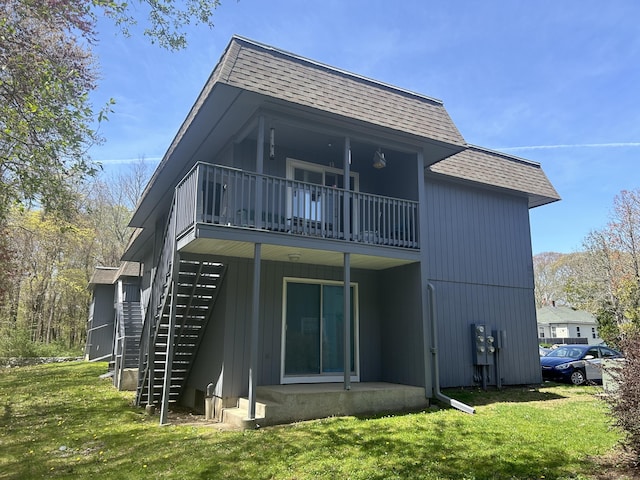 55 Virginia Ave Apt C, Groton, CT 06340 - back of property with roof with shingles, a lawn, and stairs
