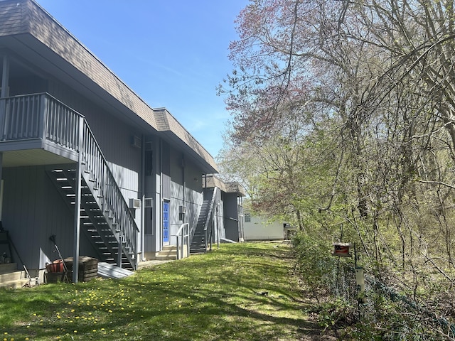 55 Virginia Ave Apt C, Groton, CT 06340 - view of property exterior featuring stairs, a yard, and mansard roof