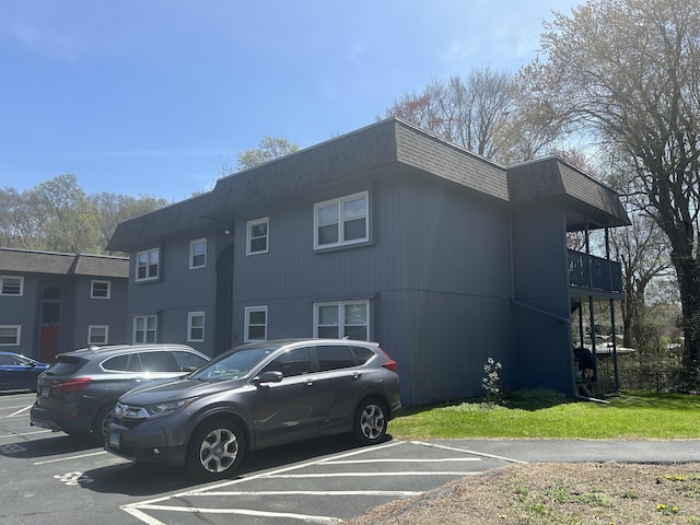 55 Virginia Ave Apt C, Groton, CT 06340 - view of front of house featuring uncovered parking, mansard roof, and a shingled roof