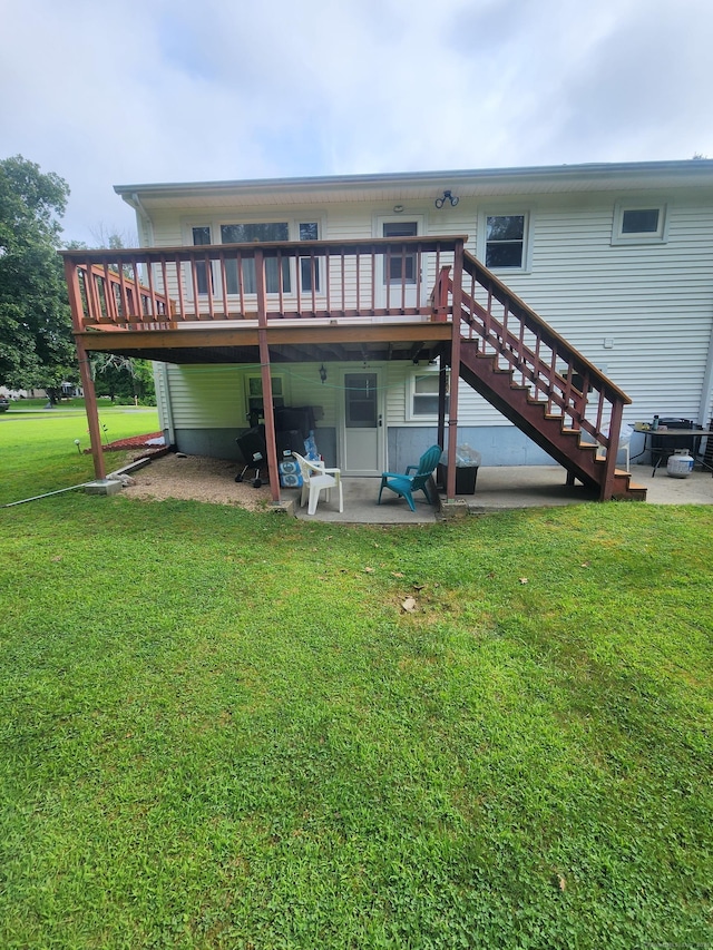 back of house featuring stairs, a lawn, a patio area, and a deck
