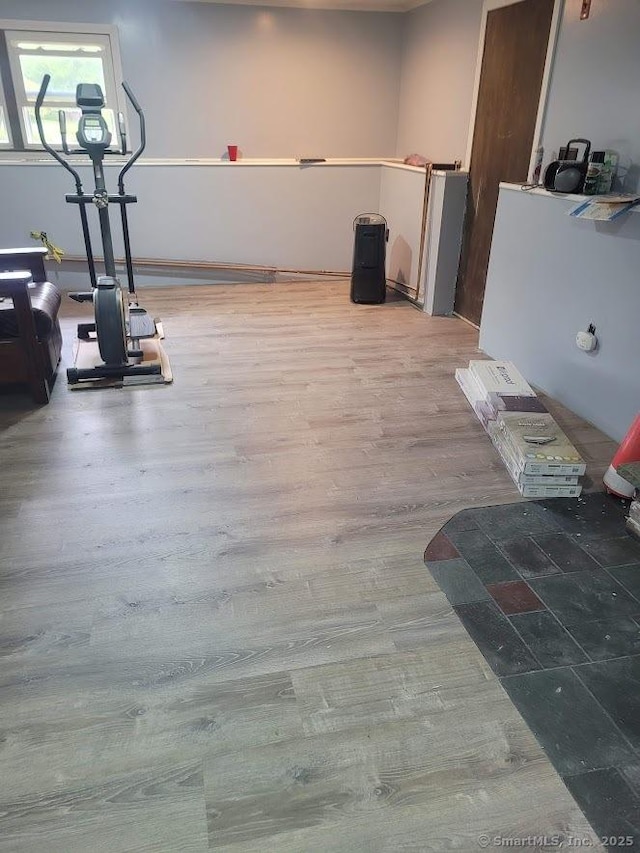 workout room featuring wood finished floors