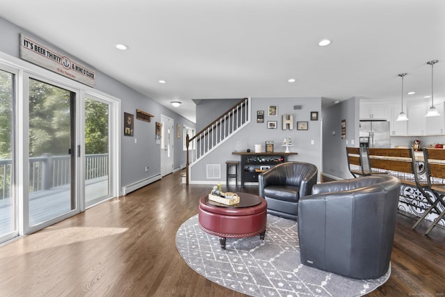 117 Mansfield Grove Rd, East Haven, CT 06512 - living room featuring a baseboard radiator, wood finished floors, stairs, and recessed lighting