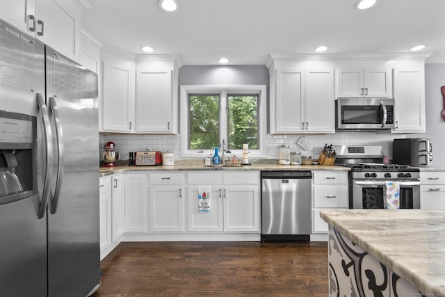 117 Mansfield Grove Rd, East Haven, CT 06512 - kitchen featuring stainless steel appliances, dark wood-style floors, recessed lighting, white cabinets, and backsplash