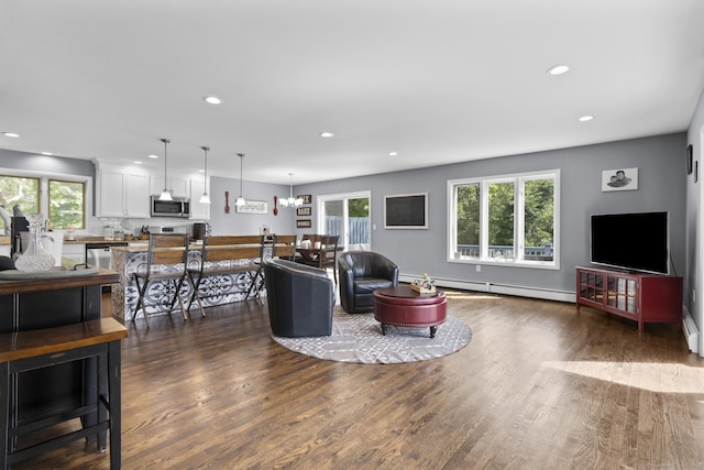 117 Mansfield Grove Rd, East Haven, CT 06512 - living room with a baseboard radiator, dark wood-style floors, recessed lighting, and a chandelier
