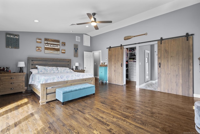 117 Mansfield Grove Rd, East Haven, CT 06512 - bedroom featuring a barn door, lofted ceiling, wood finished floors, a spacious closet, and a ceiling fan
