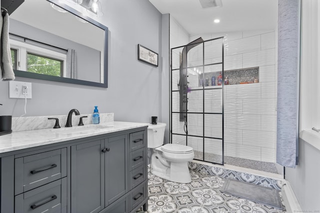 117 Mansfield Grove Rd, East Haven, CT 06512 - bathroom with vanity, a tile shower, tile patterned flooring, and recessed lighting