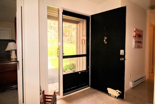 entrance foyer with a baseboard radiator and light tile patterned flooring