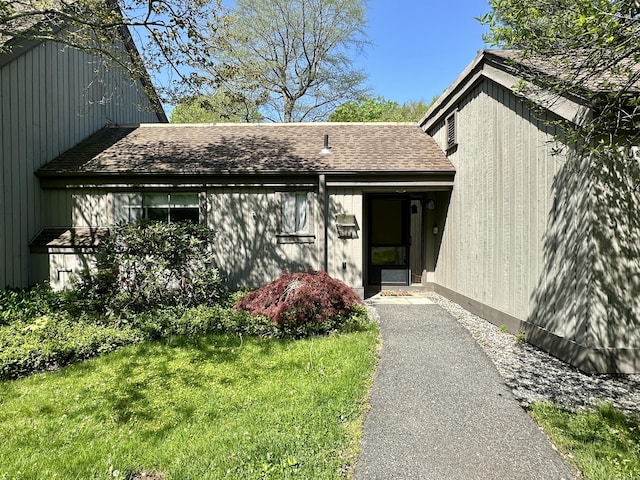 336 Heritage Vlg Unit B, Southbury, CT 06488 - view of exterior entry featuring a shingled roof