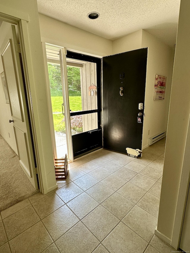 336 Heritage Vlg Unit B, Southbury, CT 06488 - foyer entrance featuring a baseboard radiator, a textured ceiling, and light tile patterned floors