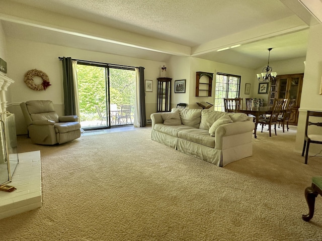 336 Heritage Vlg Unit B, Southbury, CT 06488 - carpeted living area with a chandelier and a textured ceiling