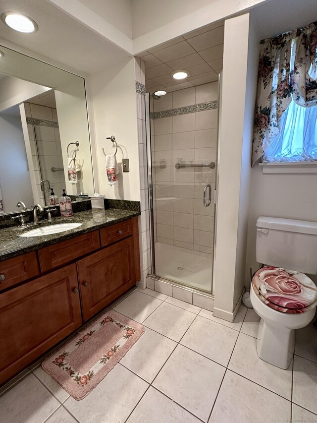 336 Heritage Vlg Unit B, Southbury, CT 06488 - bathroom with toilet, vanity, a shower stall, tile patterned flooring, and baseboards