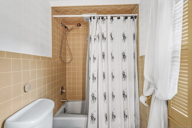 full bathroom with tile walls, shower / bathtub combination with curtain, and toilet