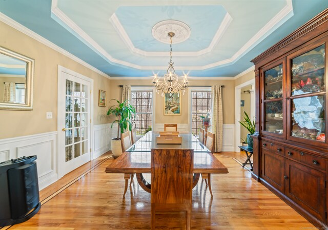 24 Scott Rd, Oxford, CT 06478 - dining space featuring a chandelier, a tray ceiling, a decorative wall, a wainscoted wall, and ornamental molding