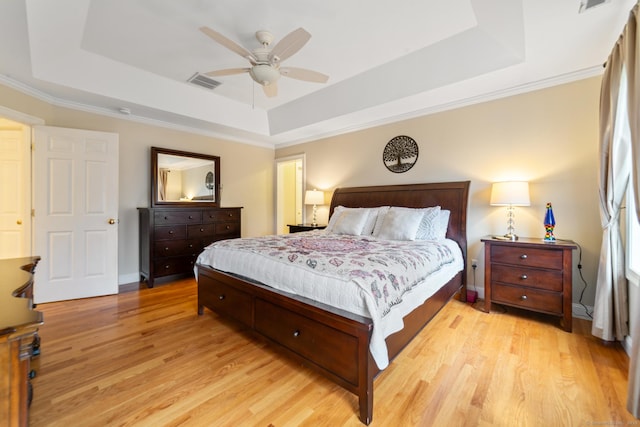 24 Scott Rd, Oxford, CT 06478 - bedroom featuring a tray ceiling, light wood-style floors, baseboards, ceiling fan, and crown molding