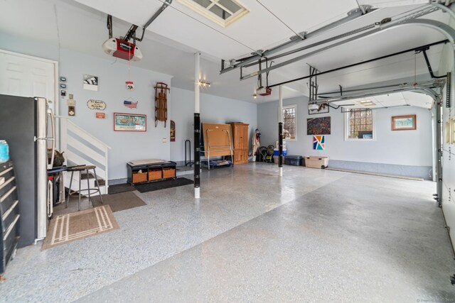 24 Scott Rd, Oxford, CT 06478 - garage featuring freestanding refrigerator and a garage door opener