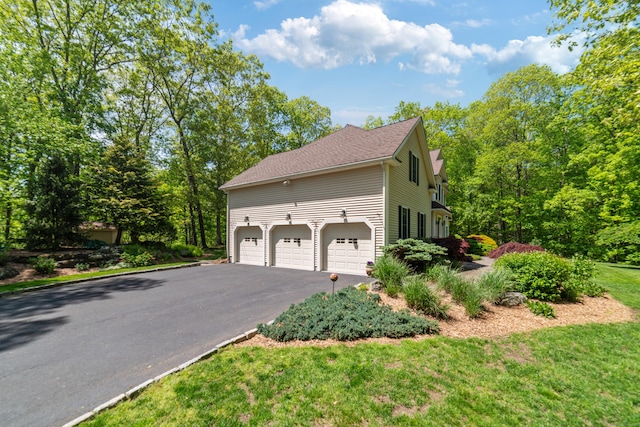 24 Scott Rd, Oxford, CT 06478 - view of property exterior featuring asphalt driveway and an attached garage