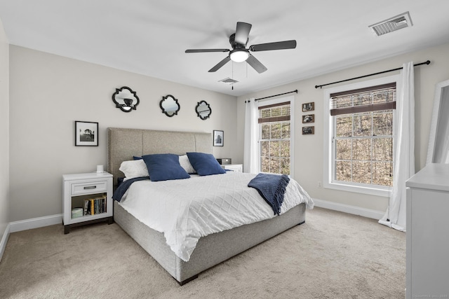 bedroom with visible vents, carpet, and baseboards