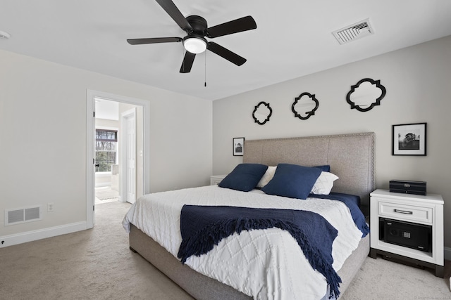 bedroom with carpet, visible vents, ensuite bathroom, and baseboards