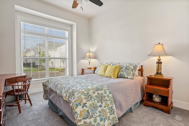 bedroom featuring carpet floors, a ceiling fan, and baseboards