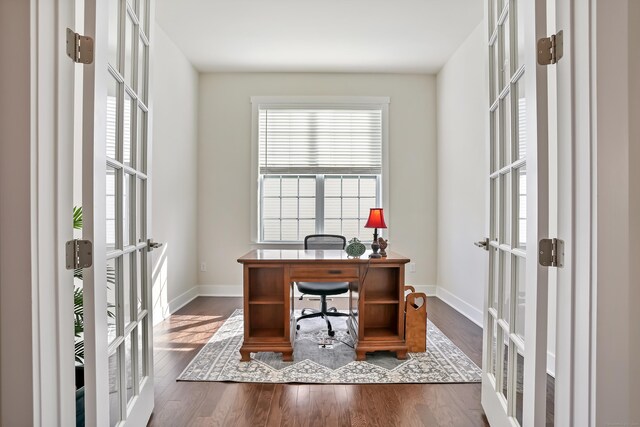 office with baseboards, french doors, and wood finished floors