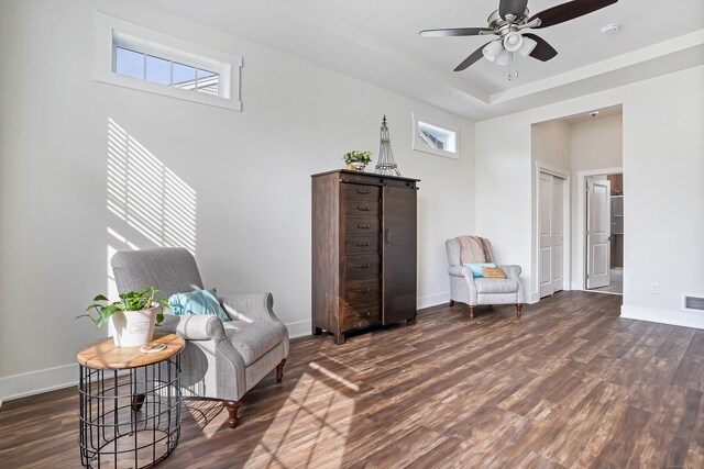 sitting room featuring baseboards, ceiling fan, wood finished floors, and visible vents
