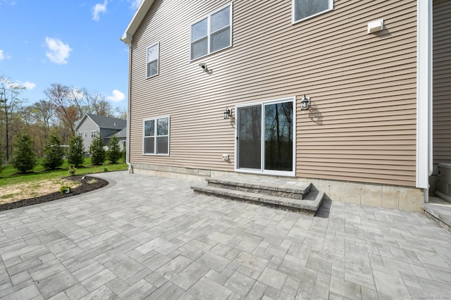 rear view of property featuring a patio