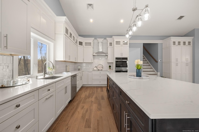 kitchen featuring a sink, white cabinetry, and stainless steel appliances