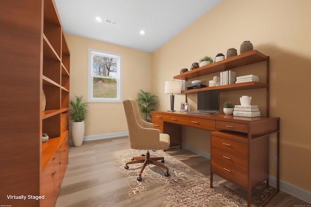 office area featuring baseboards, visible vents, and light wood-style flooring