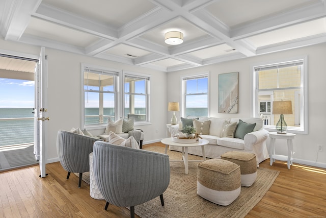 living room featuring baseboards, beamed ceiling, coffered ceiling, and wood finished floors