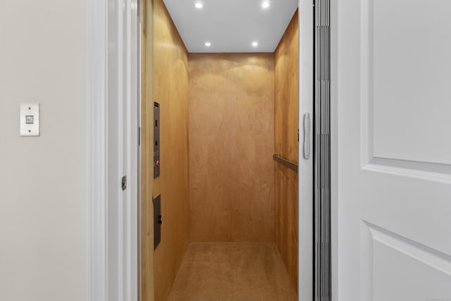 room details featuring elevator and recessed lighting