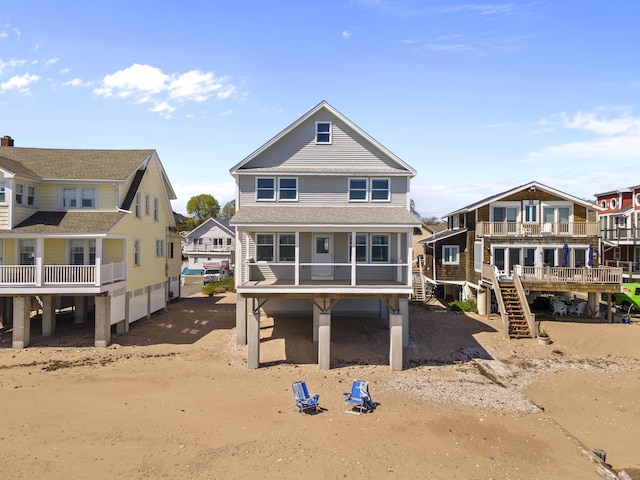 back of property featuring a residential view