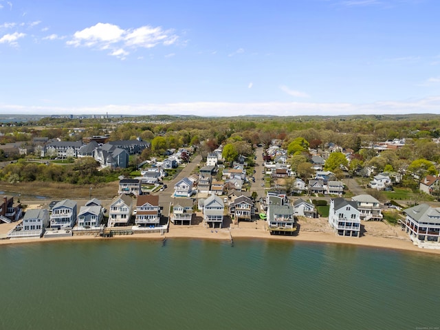 drone / aerial view featuring a water view and a residential view