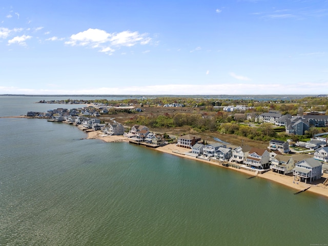 birds eye view of property featuring a water view and a residential view