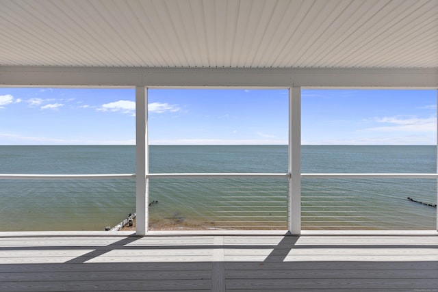 wooden terrace with a water view