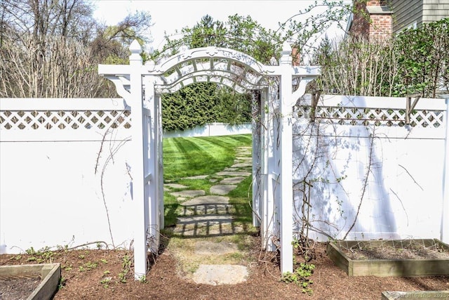 view of gate with fence