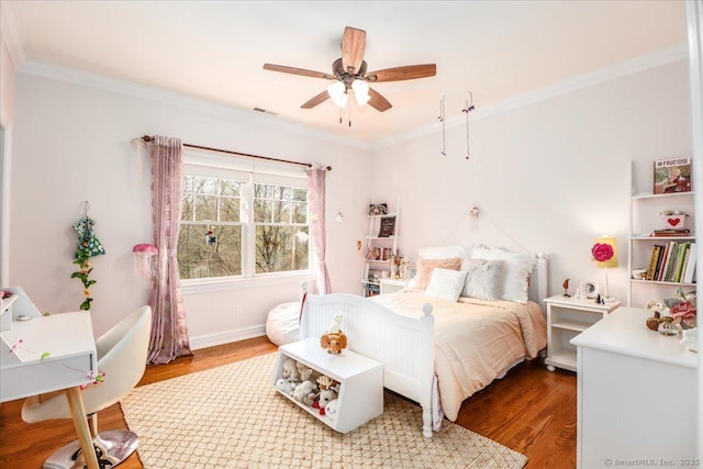 bedroom featuring visible vents, wood finished floors, a ceiling fan, and crown molding