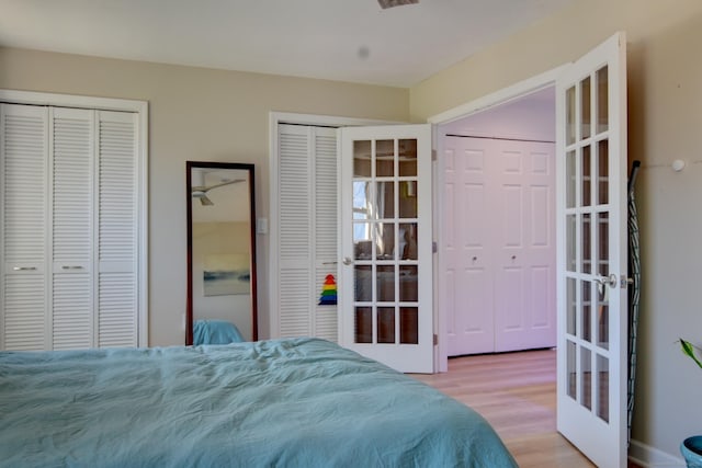 53 E Broadway Unit D, Milford, CT 06460 - bedroom featuring wood finished floors and multiple closets