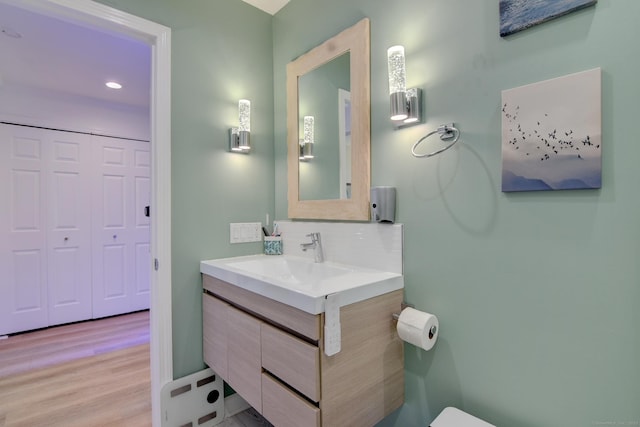 53 E Broadway Unit D, Milford, CT 06460 - bathroom featuring recessed lighting, wood finished floors, backsplash, and vanity