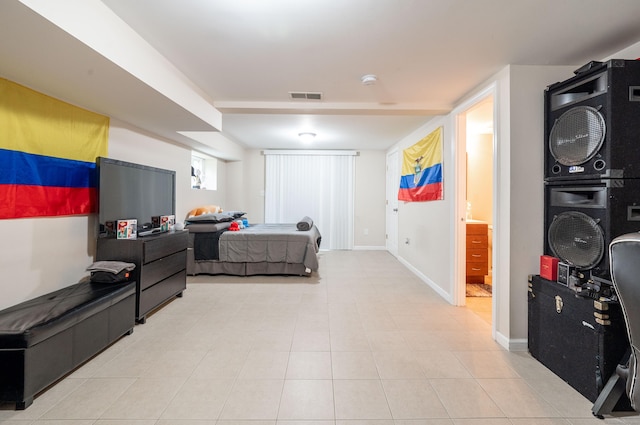 bedroom featuring visible vents and baseboards