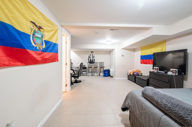 bedroom featuring tile patterned floors, baseboards, and visible vents