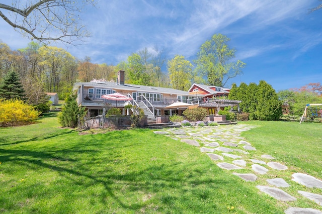 70 N Lake Shore Dr, Brookfield, CT 06804 - back of house with a chimney, stairway, a lawn, and a deck