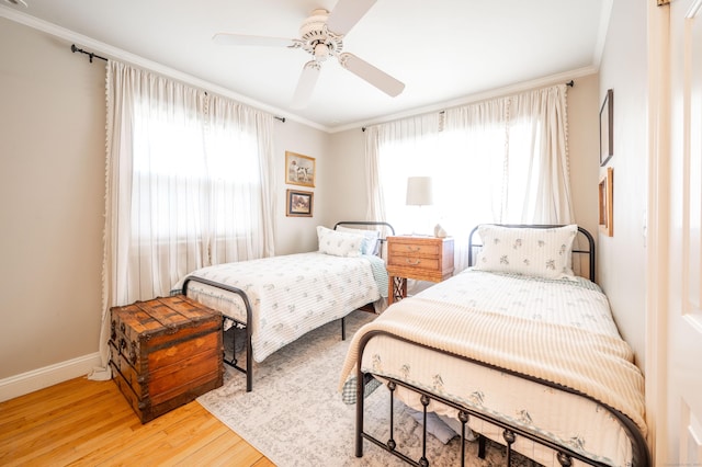 70 N Lake Shore Dr, Brookfield, CT 06804 - bedroom featuring baseboards, ornamental molding, light wood-style flooring, and ceiling fan