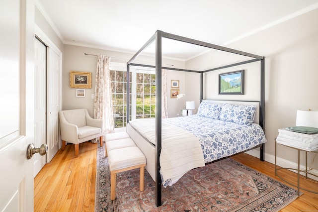 70 N Lake Shore Dr, Brookfield, CT 06804 - bedroom featuring a closet, ornamental molding, baseboards, and wood finished floors