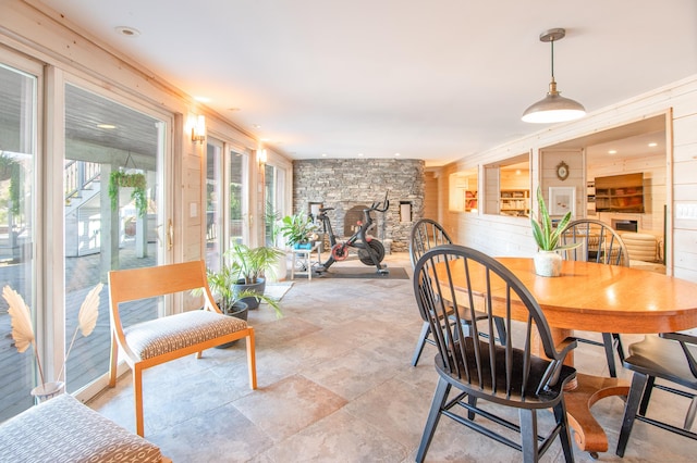 70 N Lake Shore Dr, Brookfield, CT 06804 - dining room with wood walls and stone finish flooring