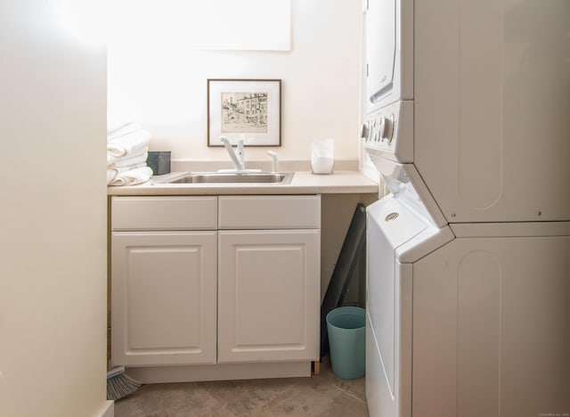 70 N Lake Shore Dr, Brookfield, CT 06804 - clothes washing area featuring cabinet space, light tile patterned floors, a sink, and stacked washer / dryer