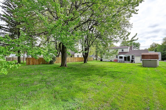 view of yard with a storage unit and an outdoor structure