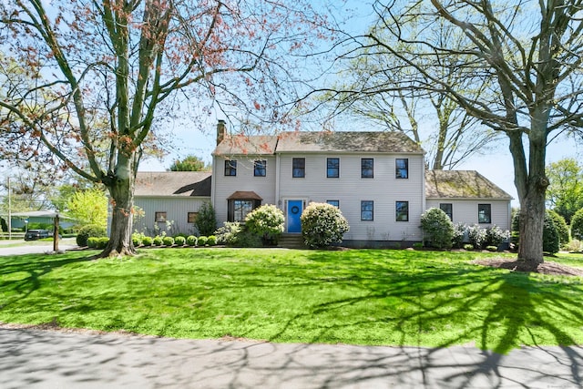 245 Sailors Ln, Bridgeport, CT 06605 - view of front of house with a chimney and a front yard